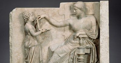 Ancient Greek statue with woman ‘using laptop' is ‘time travel proof’ in bizarre theory