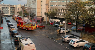 Scots woman rescued from flat fire by hero crews as street closed off