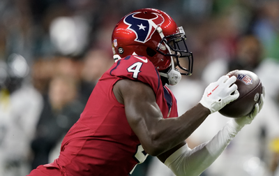 NFL fans were mixed on the Texans’ scorching red alternate helmets for their TNF date with the Eagles