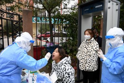 China COVID cases surge to 6-month high as tensions in affected cities build