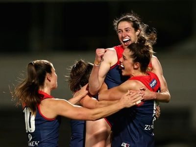 Demons surge to AFLW final win over Crows
