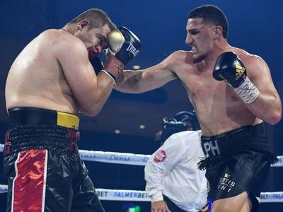 Rocked Huni prevails in heavyweight test