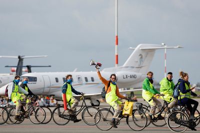 Climate activists block private jets at Amsterdam's Schiphol Airport