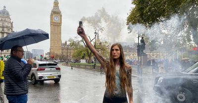 Near-naked bird lover in protest march to save her feathered friends