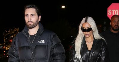 Kim Kardashian looks stony faced as she goes for dinner with Kourtney's ex Scott Disick