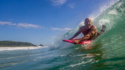 'Gut slider' laydown surfboard gets senior, injured surfers back on the waves