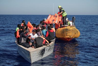 Italy lets minors, sick off migrant rescue boat but spurns others