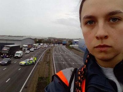 ‘You’ll hate me for this’: Tearful Just Stop Oil protester climbs gantry amid M25 chaos