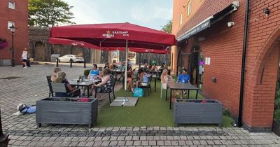 Vandals caught on CCTV throwing Swansea restaurant's parasol and seating worth more than £2k into the water