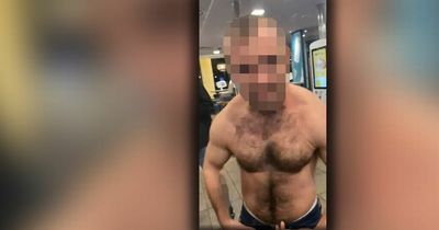 'What you gonna do about it?'...shirtless thug 'flexes muscles' as he unleashes racist rant at McDonald's customer