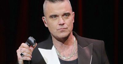 Robbie Williams forced to rewrite bio movie after portraying enemies as 'a***holes'