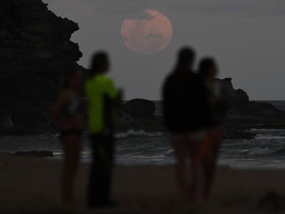 Blushing moon lights up Australian skies