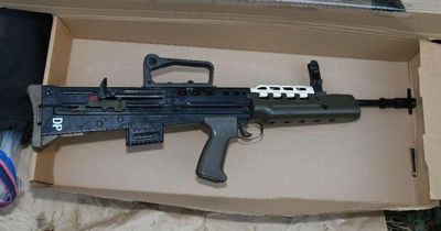 Two arrested as British army issue assault rifle and handgun found buried in park