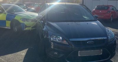 Drug-driver caught 'hitting himself in the face and chewing his lips' as he passed police car