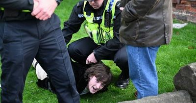 Eggs thrown at King Charles during walk as police wrestle man to the ground and detain him