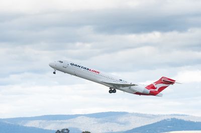 Qantaslink plane evacuated after catching fire at airport