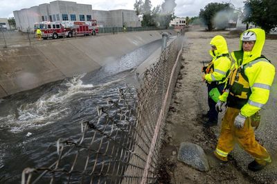 One dead and two missing as snow and rain hit California, raising fears of flash flooding