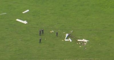 Two dead after planes crash mid-air with witnesses hearing 'big bang' in the sky