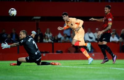 Mallorca sink Atletico, Real Sociedad beat nine-man Sevilla