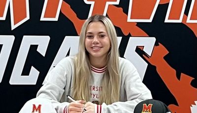 Signing Day: Libertyville’s Emily Fisher, one of six local Big Ten recruits, signs with Maryland