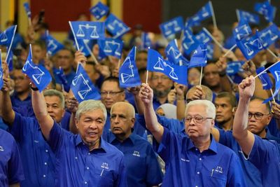 Unfazed by scandals, Malaysia’s old party seeks win in polls