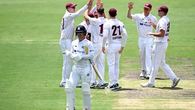 Queensland bowls out Victoria for 63 in 32.4 overs on day one of the Sheffield Shield match at Allan Border Field