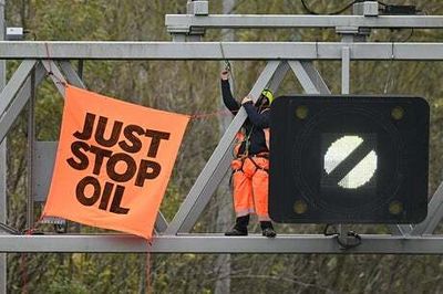Just Stop Oil: M25 targeted for fourth day as activists attempt to climb gantries and stop traffic