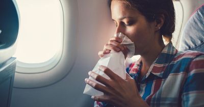 Woman 'disgusted' as airplane passenger throws up over her on 13-hour flight