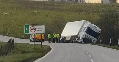 Lorry stranded after toppling into verge at sharp corner of Highlands road