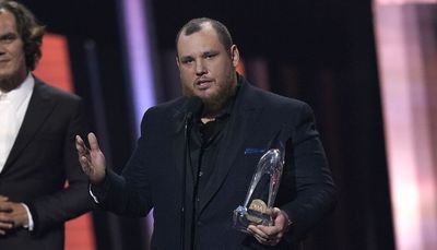 Luke Combs wins top CMA award for second time; Loretta Lynn, Jerry Lee Lewis honored