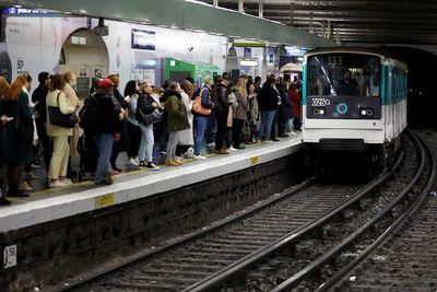 Paris commuters hit by travel disruption as metro workers strike