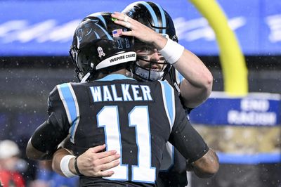 With baseball cap on, Baker Mayfield head-butts Panthers teammates wearing helmets