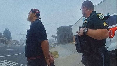 Watch Florida Cops Arrest a Legally Blind Man After Confusing His Walking Stick for a Gun
