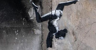 Banksy unveils artwork in Ukraine on side of damaged building