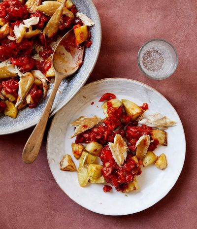 Tamal Ray’s recipe for quick roast potatoes with tomato sauce and smoked mackerel
