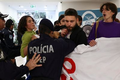 Climate protesters in Portugal storm building, urge minister to step down
