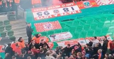 Football supporters throw flares and brawl during FAI Cup final in Dublin