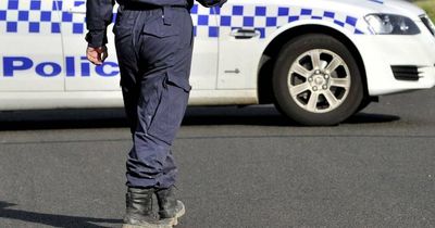 Emergency services rush to the scene of motorcycle and truck crash on New England Highway