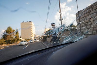 Israeli troops kill Palestinian woman in car, say incident under review