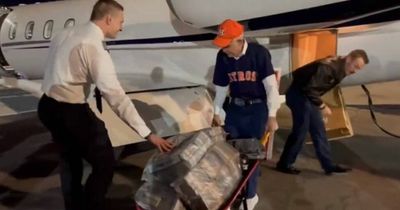 Baseball fan 'Mattress Mack' filmed with $10m in wheelbarrow after World Series bet win