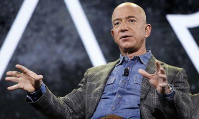 Jeff Bezos vows to give away most of fortune – and hands Dolly Parton $100m