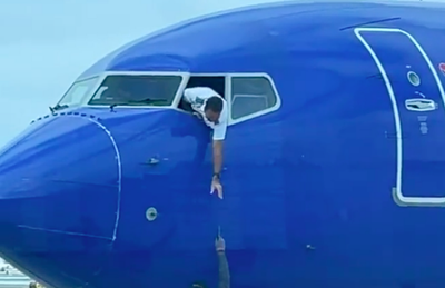 Southwest pilot dangles out of cockpit to try and reach passenger’s phone