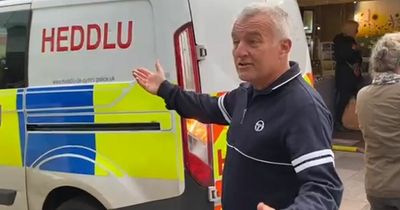 'You f***ing headcase': Angry passer-by clashes with protesters chained to bank in Cardiff