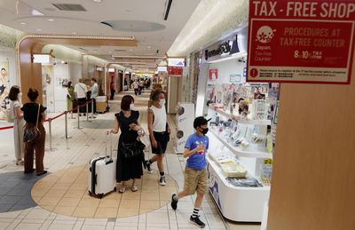 Japan's economy shrinks as consumers hold back on spending