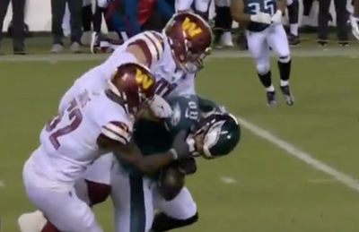 A brutal uncalled facemask cost the Eagles a fourth quarter fumble and NFL fans were furious