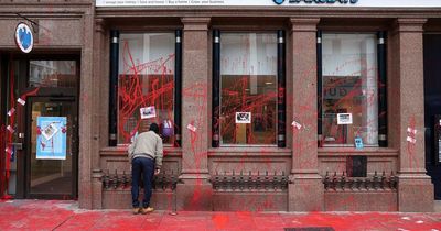 Belfast Barclays Bank protest sees two people charged after building targeted with red paint