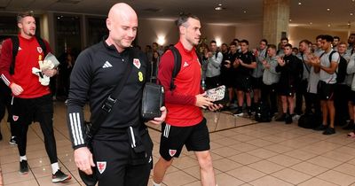 Wales rugby squad form guard of honour and applaud football team out of hotel