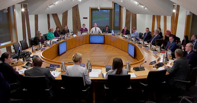 Scottish Parliament apologises for throwing woman out who wore suffragette-style scarf