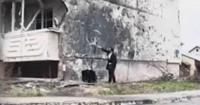 Banksy 'captured on CCTV in Ukraine' painting work of art near Kyiv