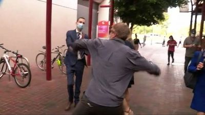 Murderer's brother to fight allegations he assaulted a journalist outside court